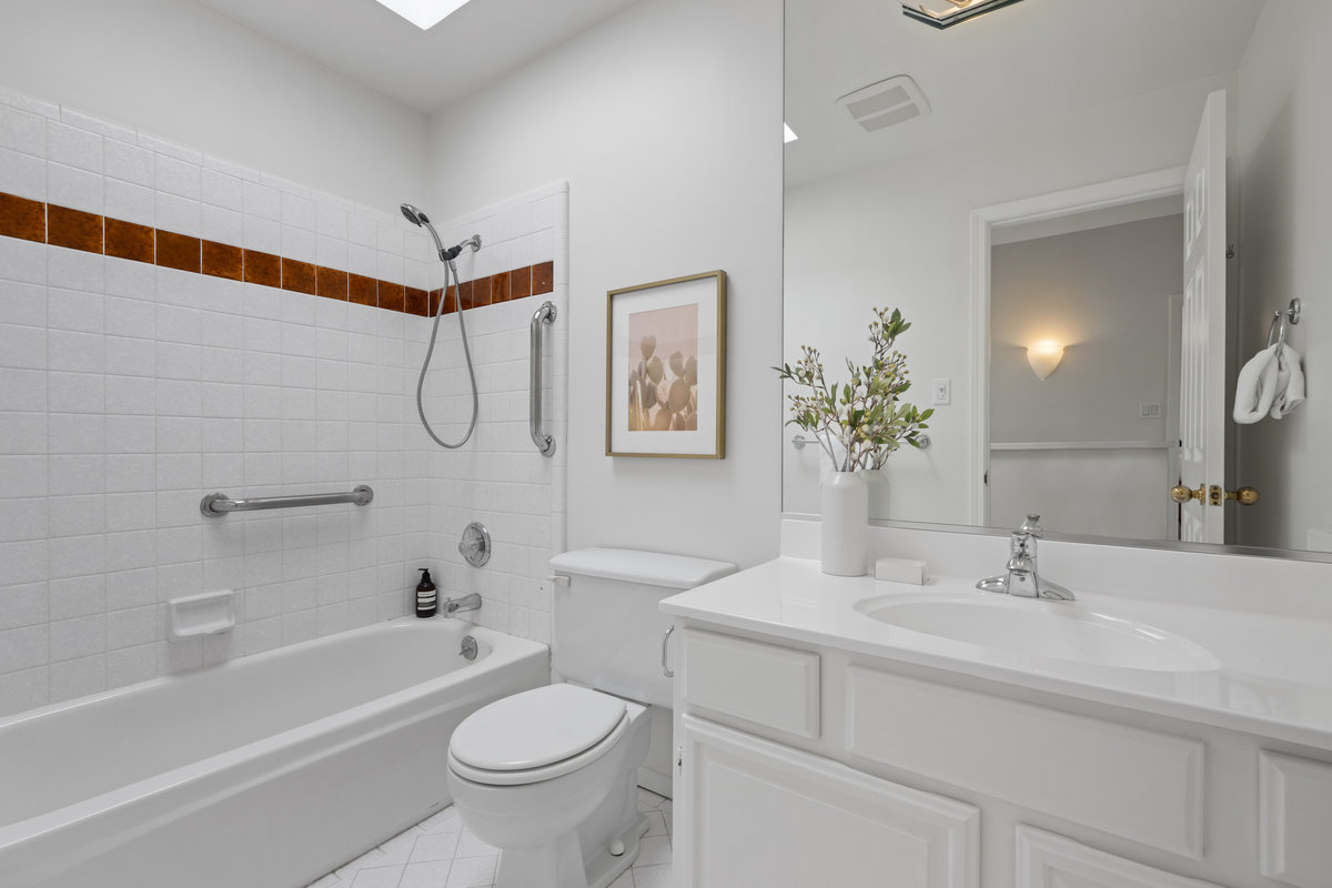 Property Photo: Guest bath has vanity and tub/shower combo. 