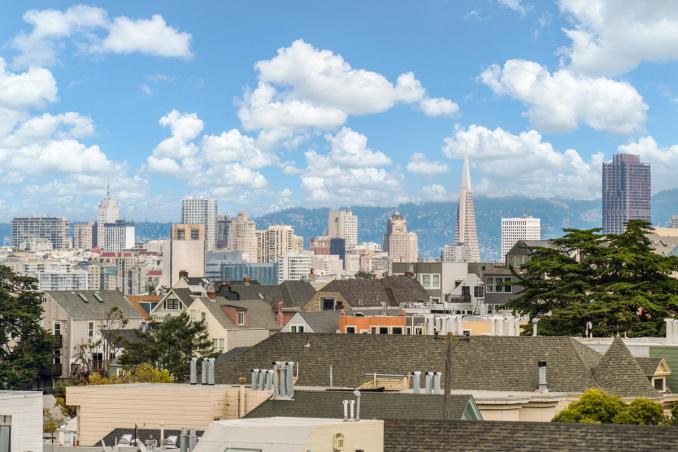 Property Thumbnail: Close up photo of the view of downtown from primary bedroom. 