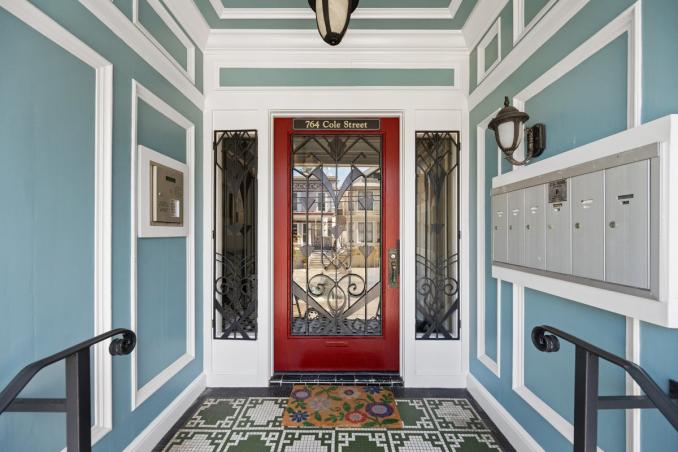 Property Thumbnail: Front entry way of 764 Carl Street. There is lots of molding detail, and red front door. 