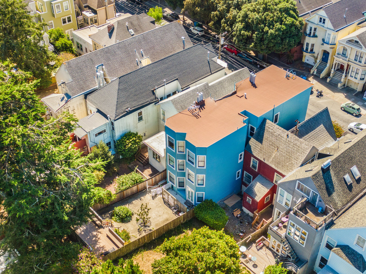 Property Photo: Aerial photo of the rear exterior of 764 Cole Street. There is a large back yard. 