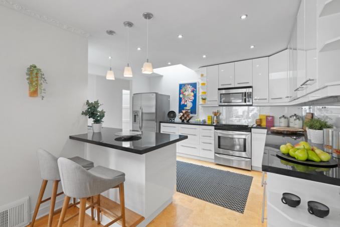 Property Thumbnail: Breakfast bar has 2 stools for seating. There is a skylight that lets in lots of natural light. 