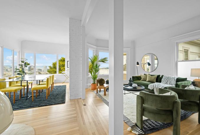 Property Thumbnail: The living and dining area is a large open floor plan. Lots of large windows letting in lots of natural light. 