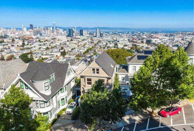 Property Thumbnail: Aerial photo of the front exterior of 171 Buena Vista. You can see san francisco in the back round. 