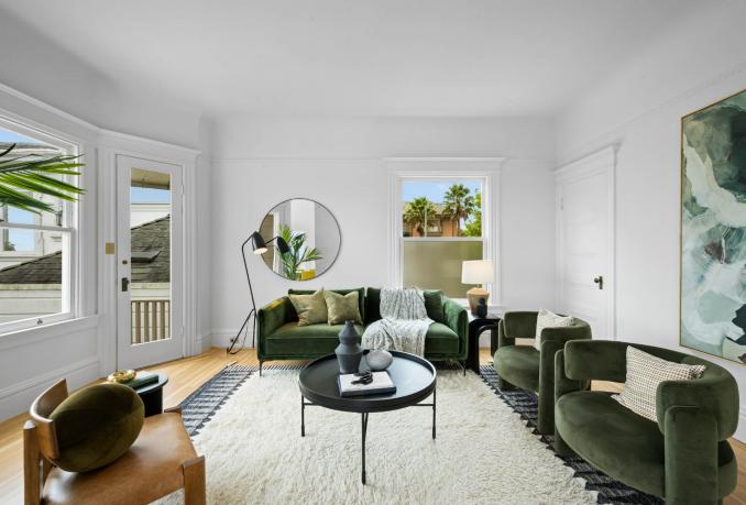 Property Thumbnail: Another angle of the living room. Windows are large with lovely sunny living area 