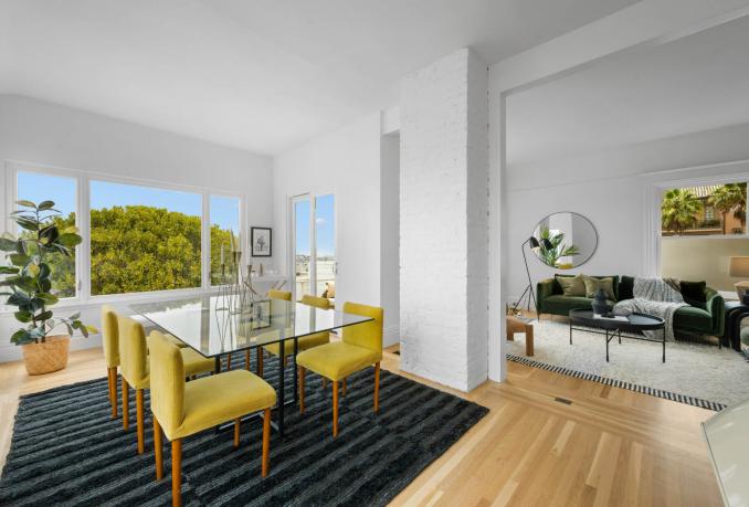 Property Thumbnail: Dining room has a large glass rectangular table that seats six. It opens right up to the living room. 