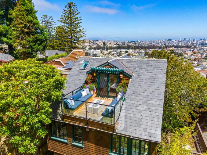 Property Thumbnail: Aerial photo looking over the back deck, and over the top of the house looking at downtown san francisco. 