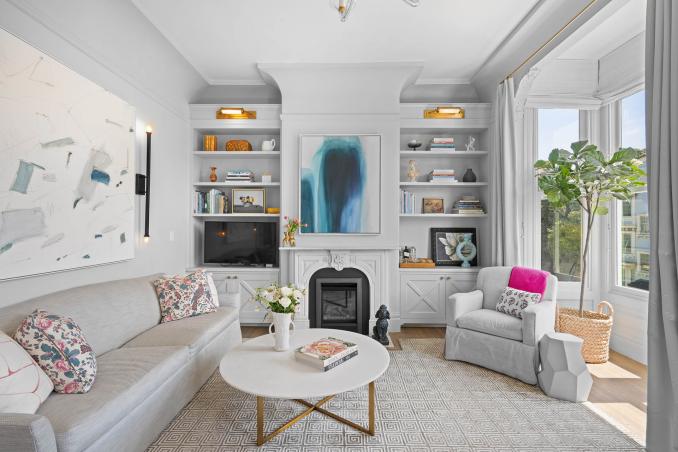 Property Thumbnail: Living room has beautiful fireplace with built-ins on each side.