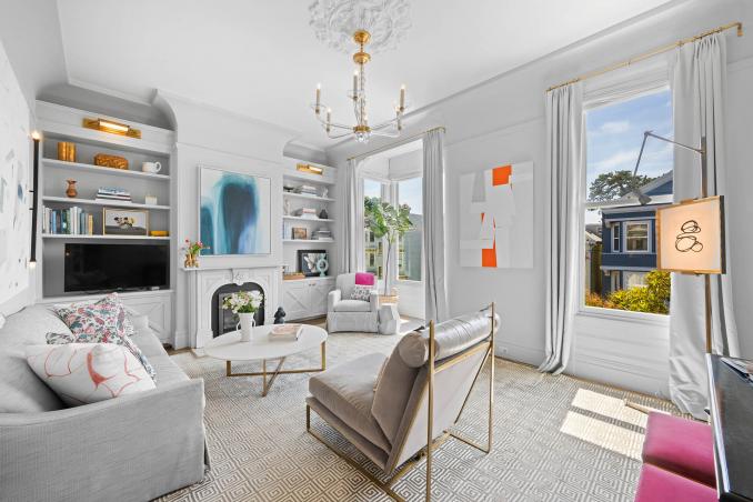 Property Thumbnail: Front living room has large windows and high ceilings. Lots of natural light. 