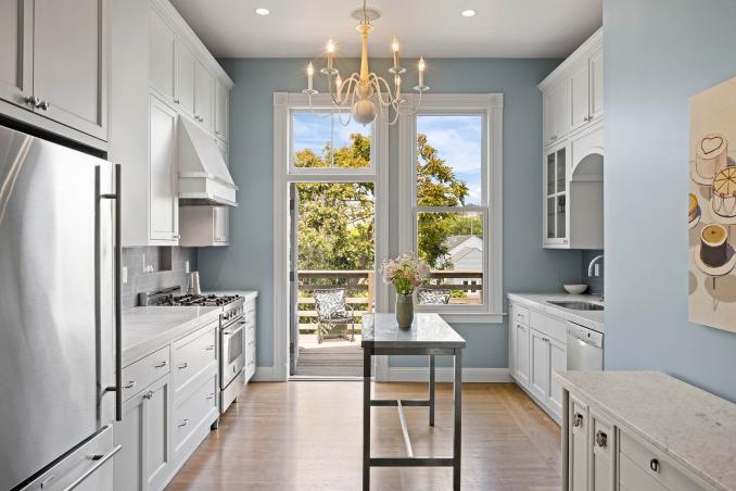 Property Thumbnail: Kitchen is beautiful. There is door to backyard and large window that lets in lots of natural light.