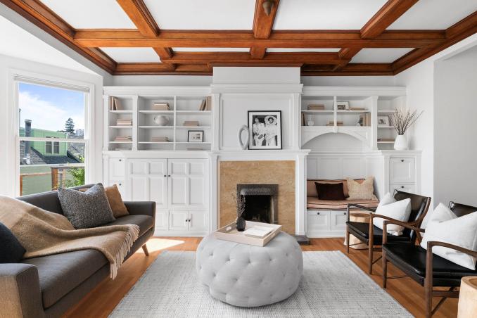 Property Thumbnail: Back living room has hardwood floors throughout and built ins around the bookcase. 