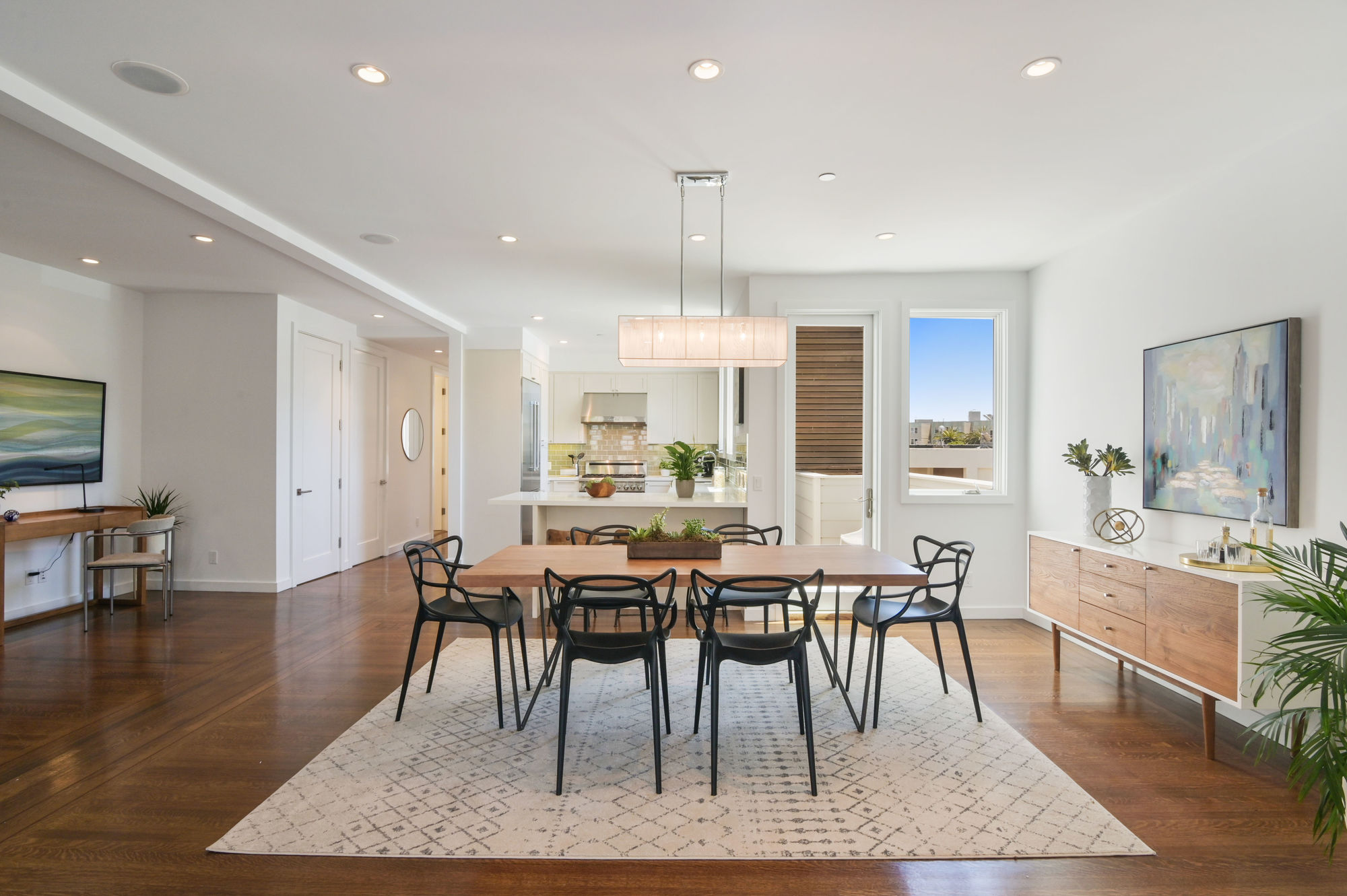 Property Photo: View of a dining area, featuring wood floors, modern fixtures, and plenty of natural light