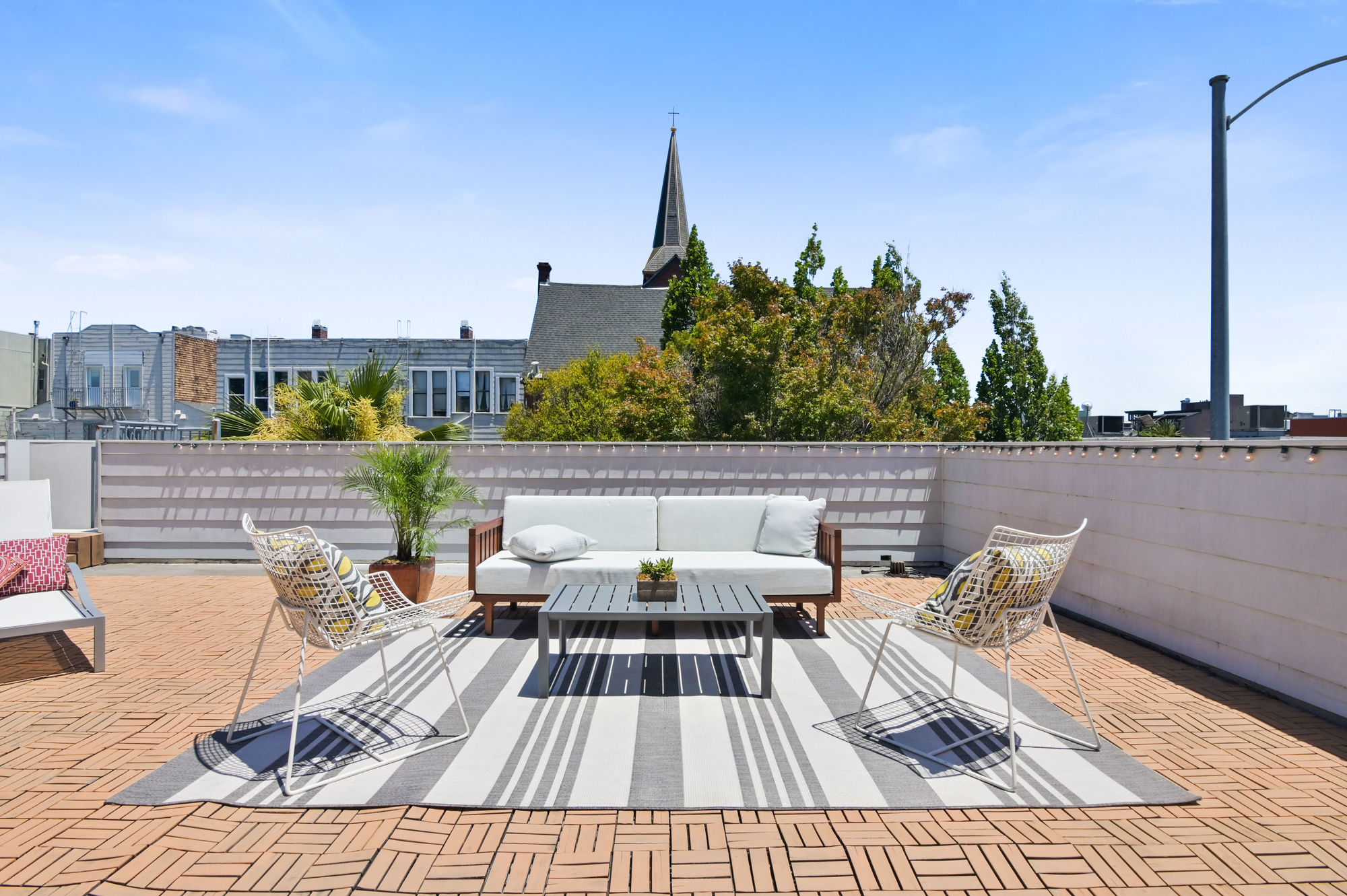 Property Photo: View of a large deck with an out door living area