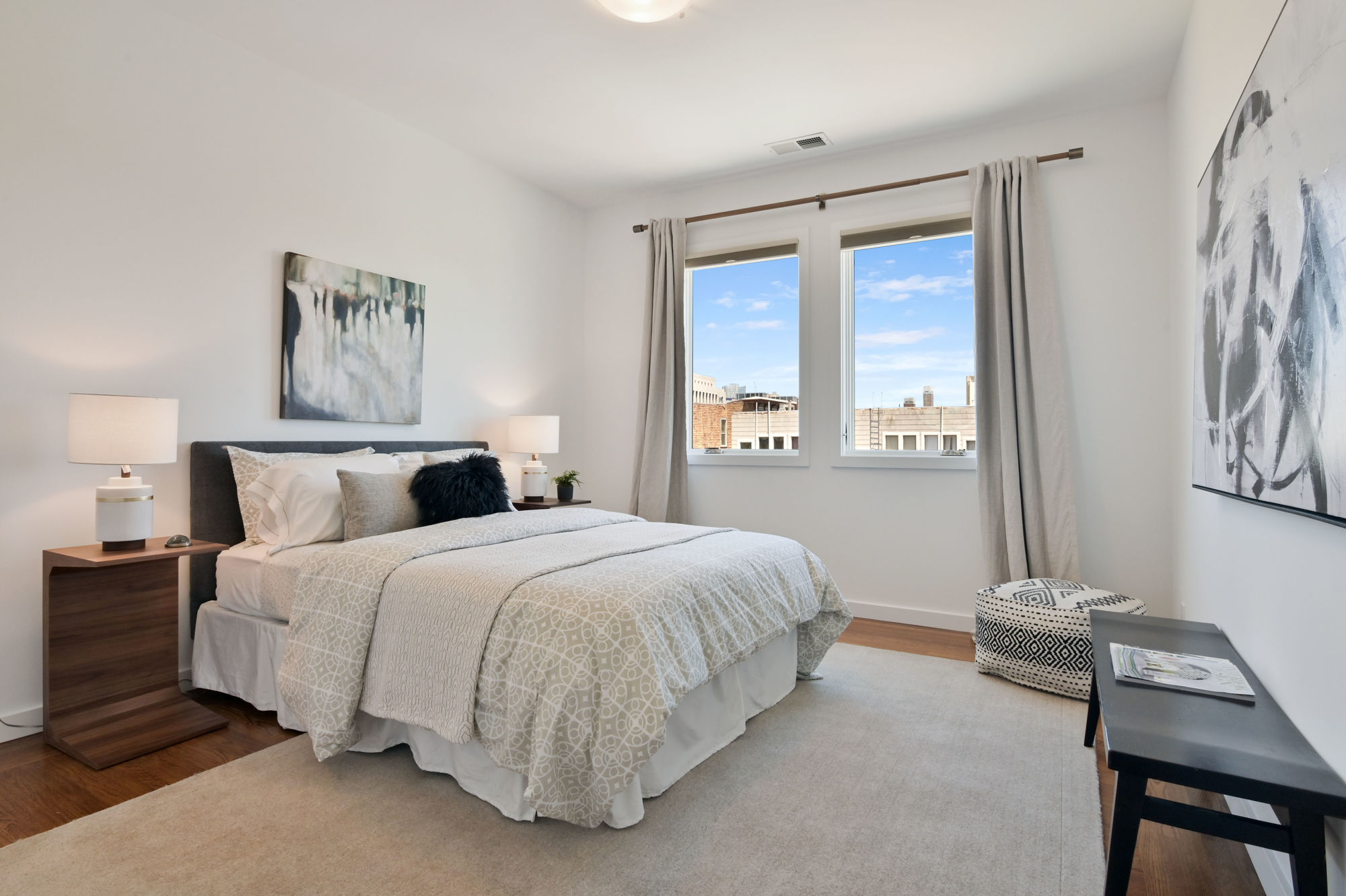 Property Photo: Bedroom, with two windows and wood floors