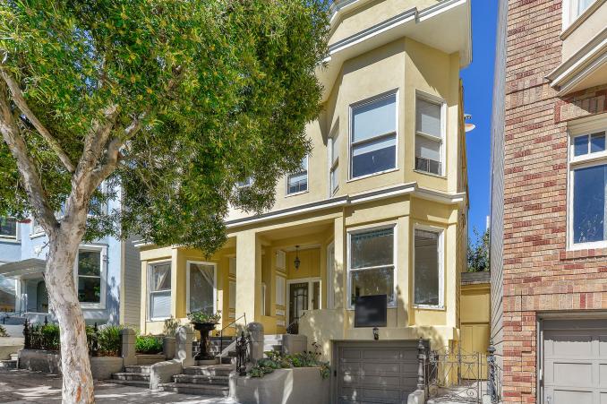 Property Thumbnail: Front exterior of 1102 Fulton Street, featuring a yellow facade