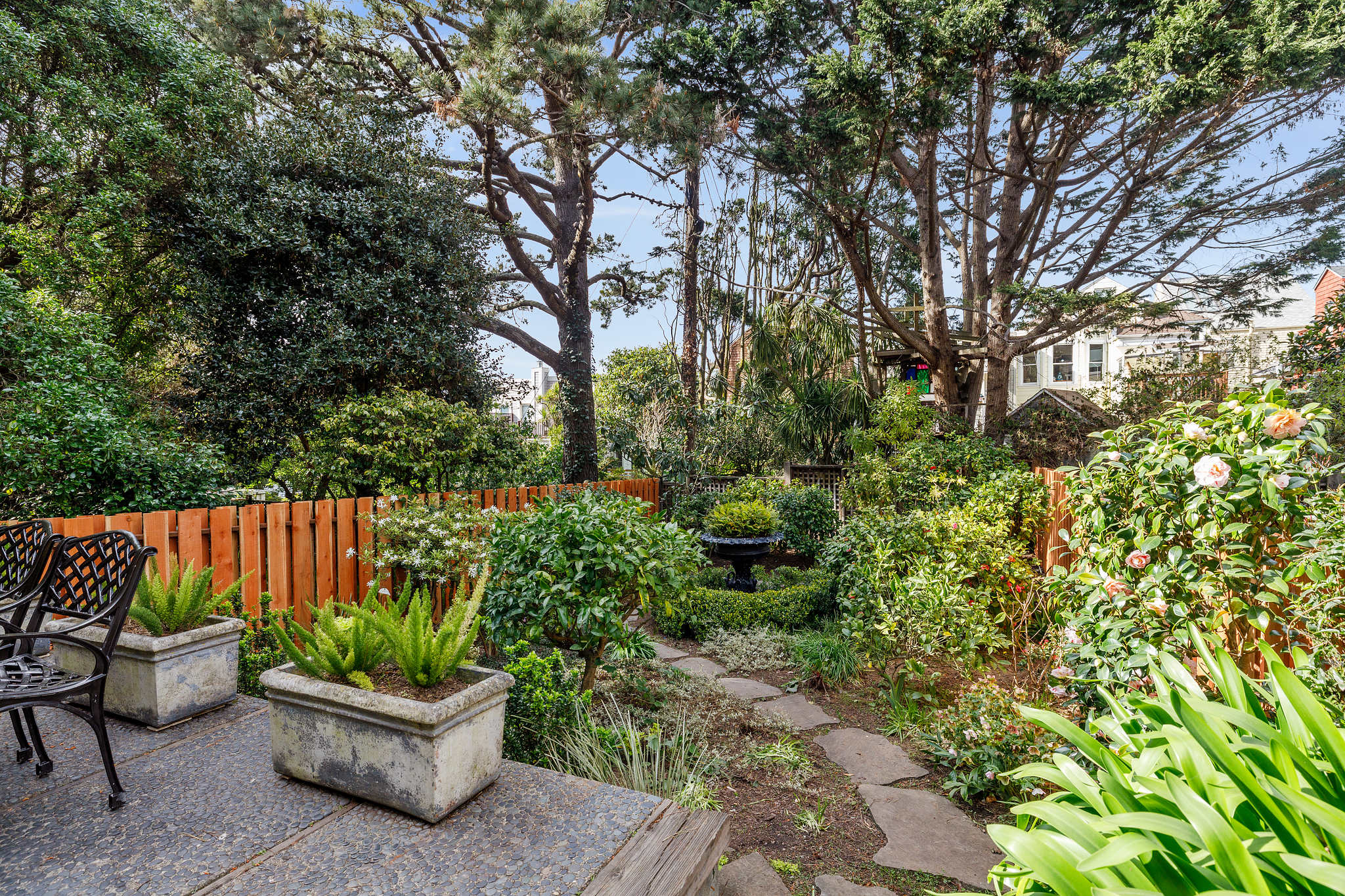 Property Photo: A stone path leading through a garden