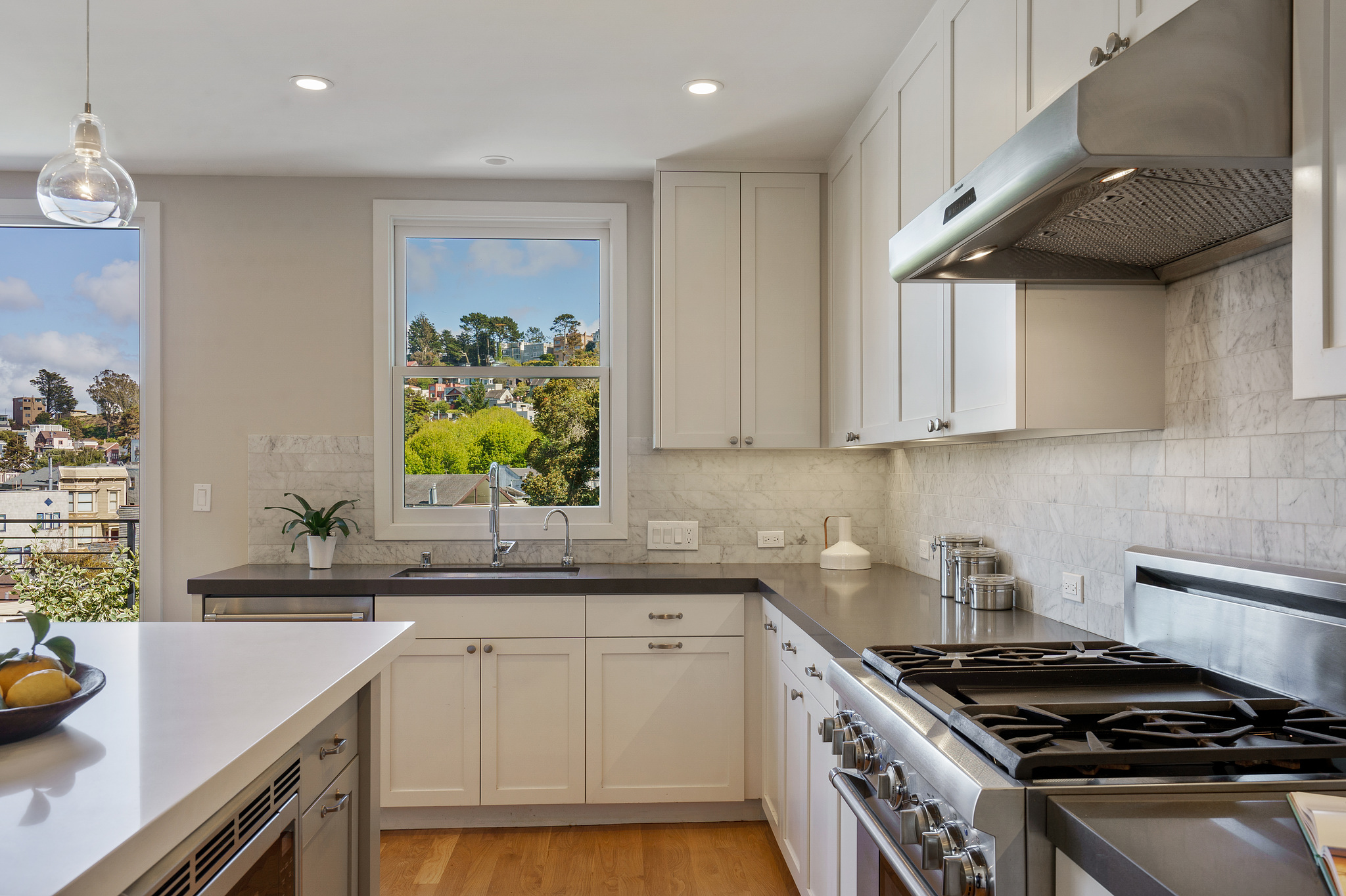 Property Photo: View of the kitchen showing the sink with large window overlooking Cole Valley