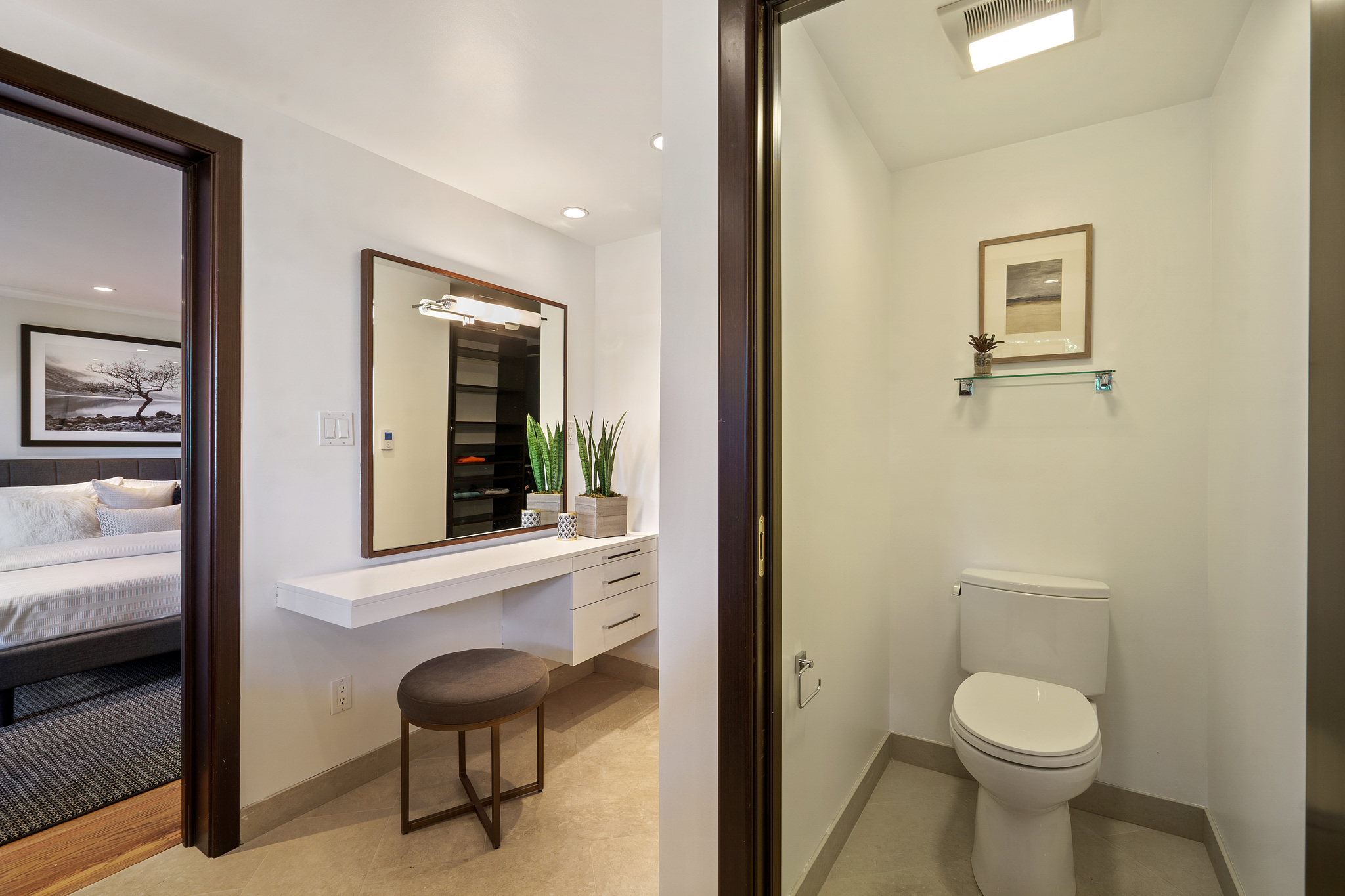 Property Photo: Bathroom with adjacent vanity and grooming area