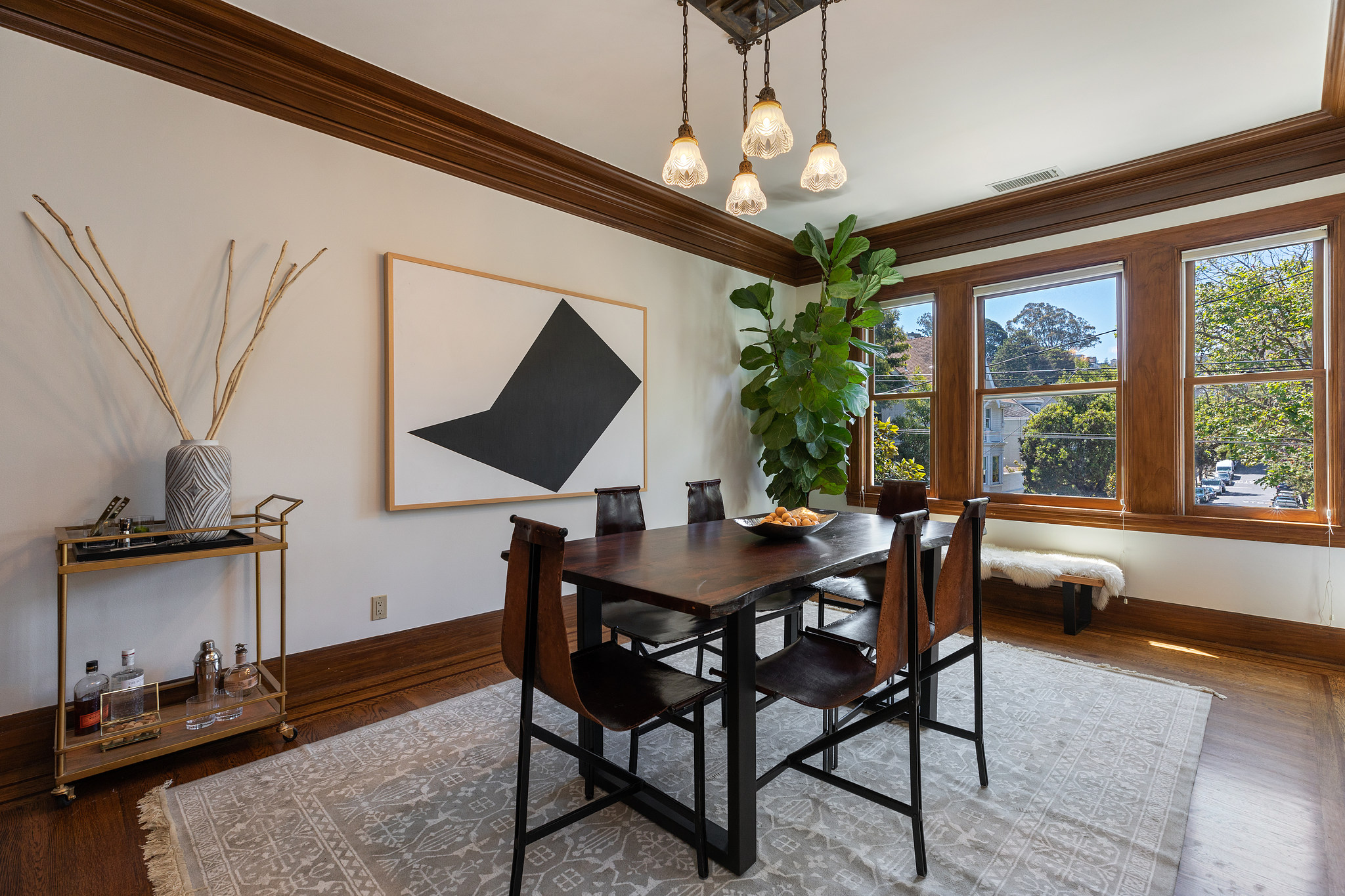 Property Photo: Formal dining room with wood trim and wood floors