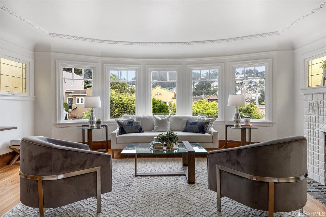 Property Photo: View of the living room at 78 Wawona Street, showing five large windows and the main seating area