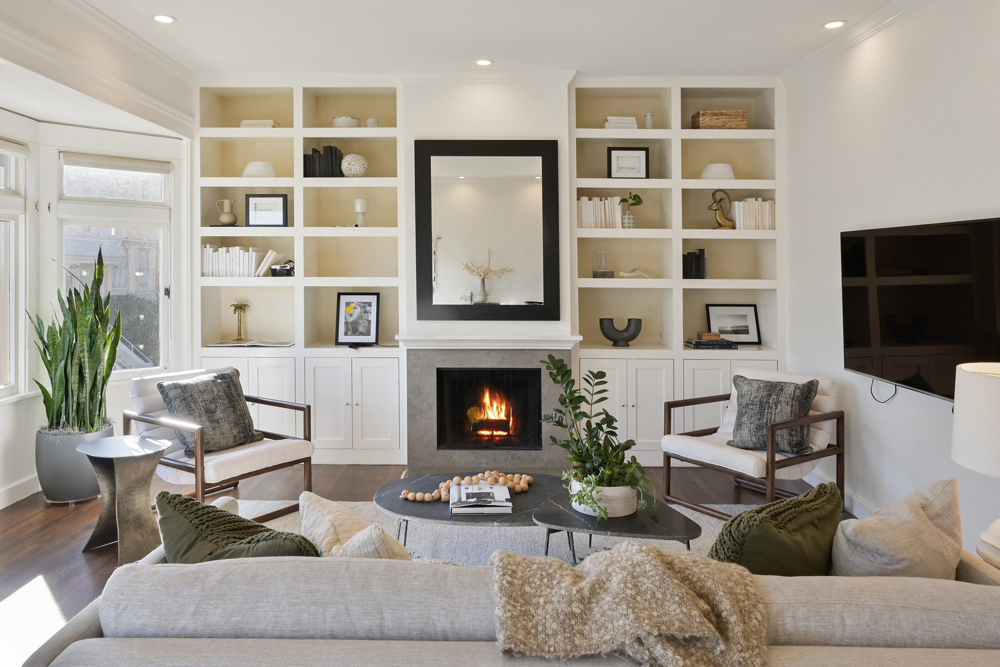 Property Photo: View of the living room, featuring a fireplace