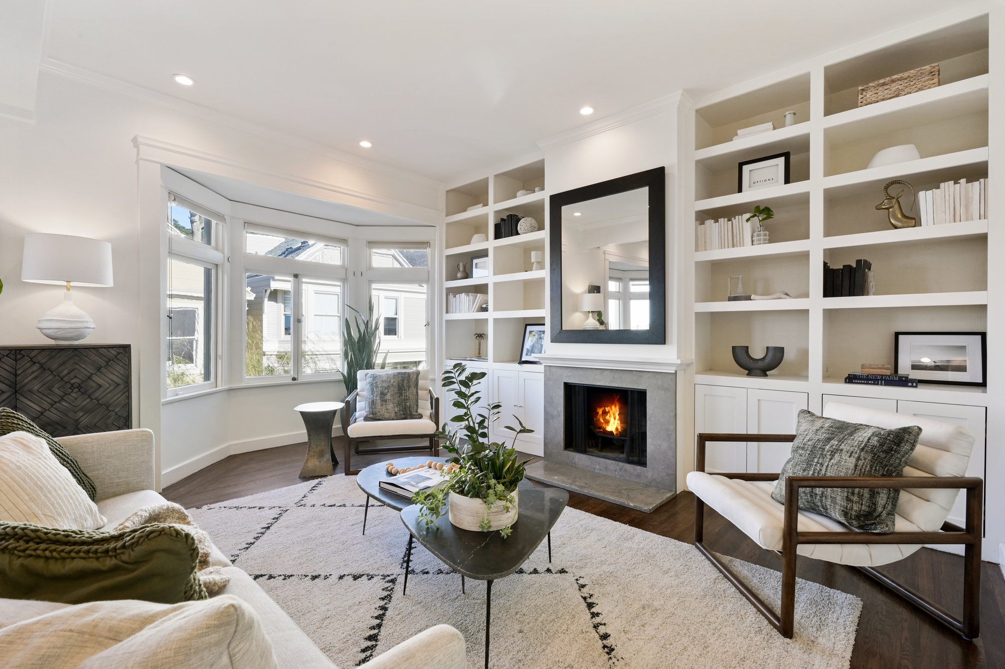 Property Photo: Living room, showing white built-in wood cabinets