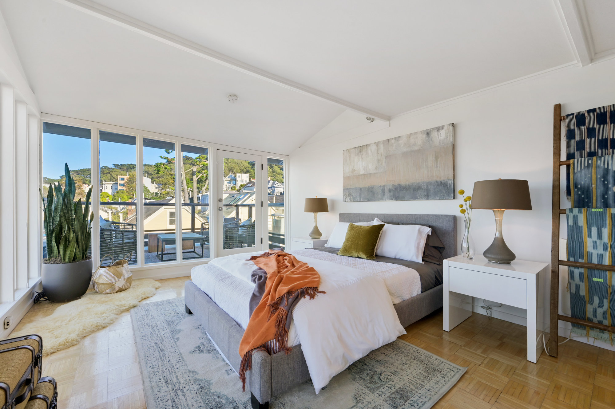 Property Photo: Bedroom with arched ceilings and wood floors