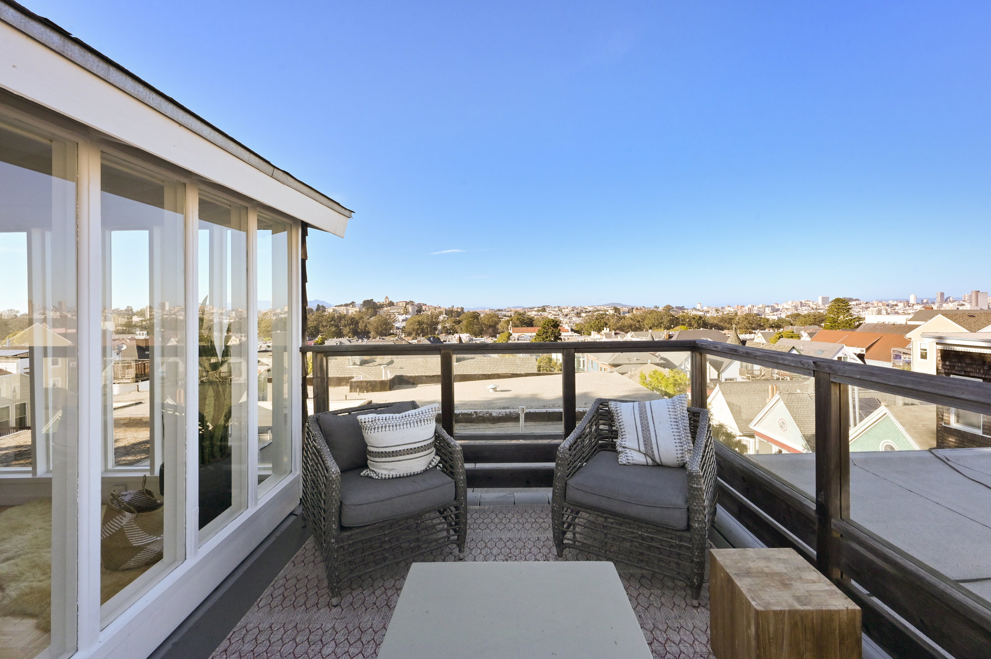 Property Photo: Long view from the roof-top deck, showing homes beyond