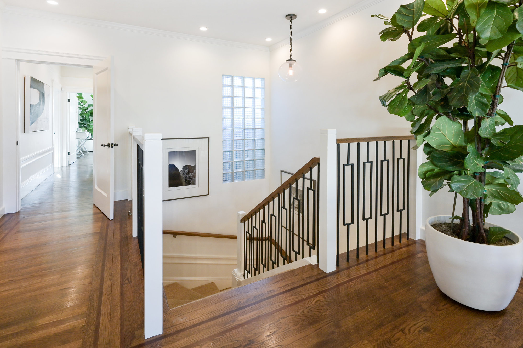 Property Photo: View of the hallway with steps leading down