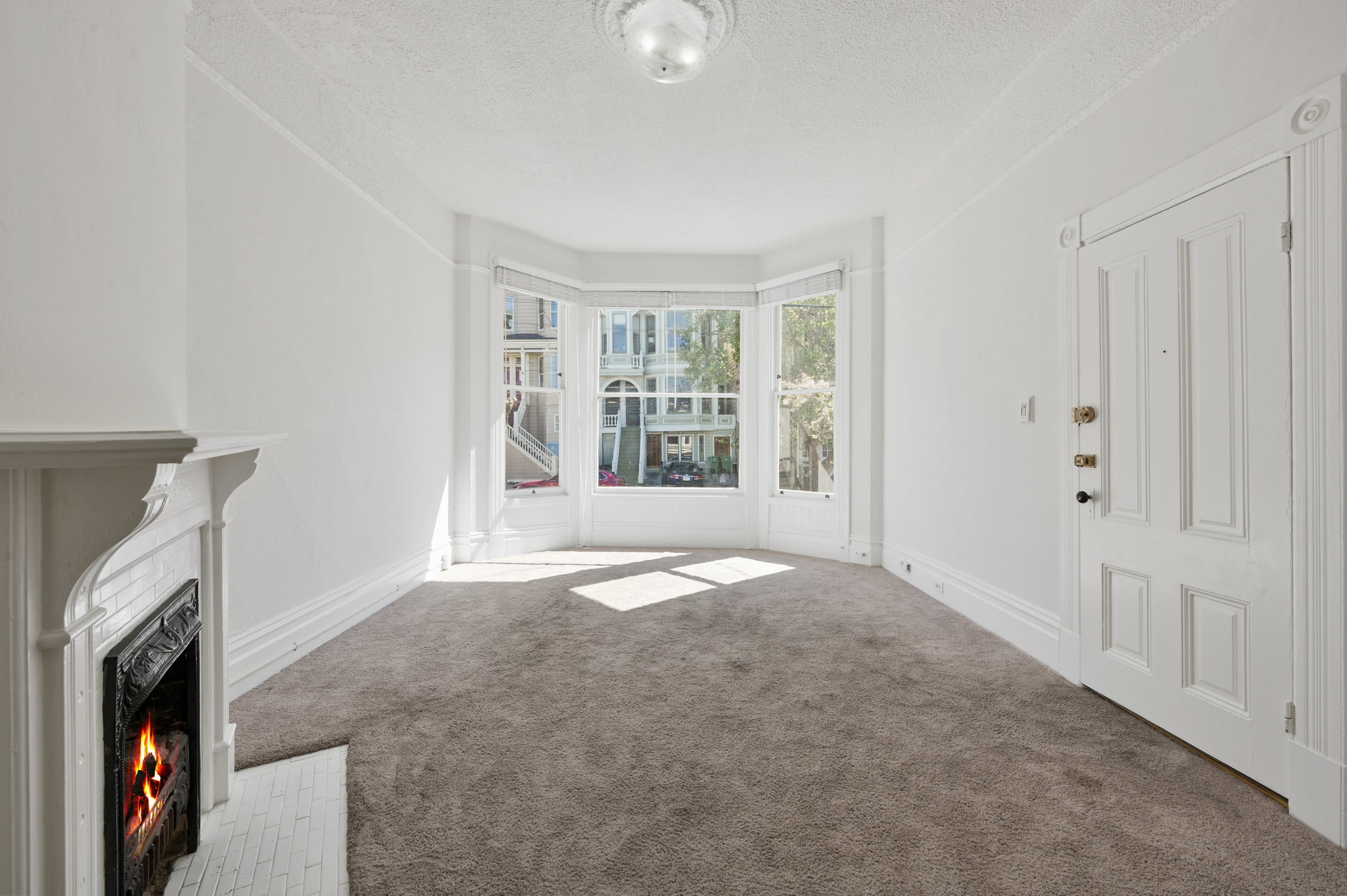 Property Photo: View of a living room with a fireplace