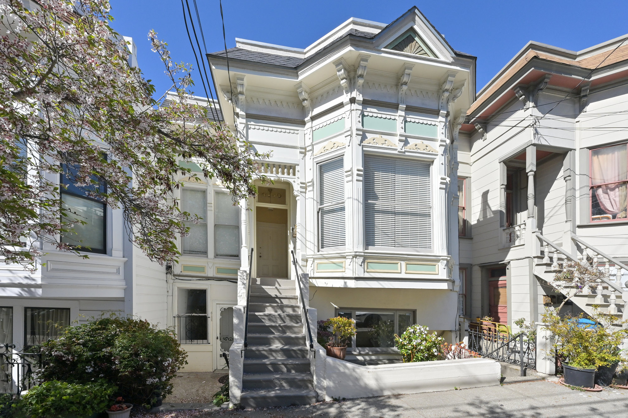 Property Photo: Close-up street view of 4160-4162 20th Street, showing windows of the lower level