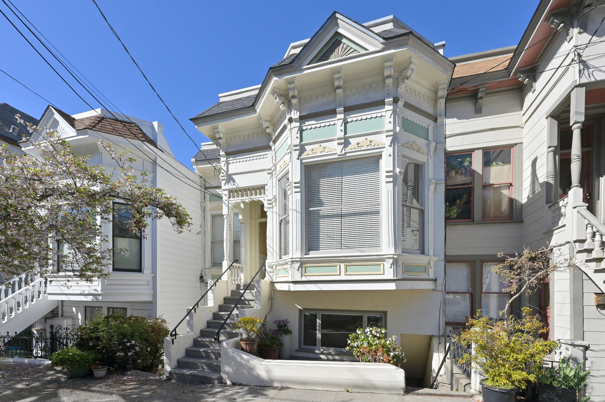 Property Photo: Exterior view of 4160-4162 20th Street, showing a house with white trim