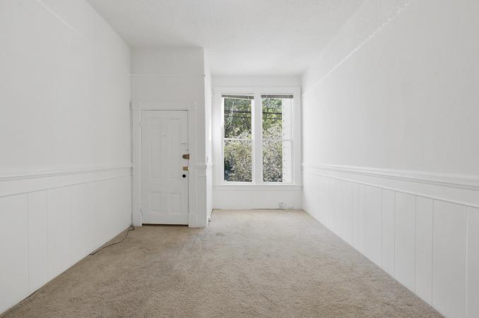 Property Thumbnail: View of a living area, featuring two large windows