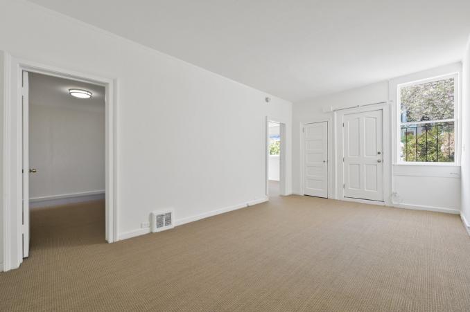 Property Thumbnail: View of a long rom with large window and carpeting