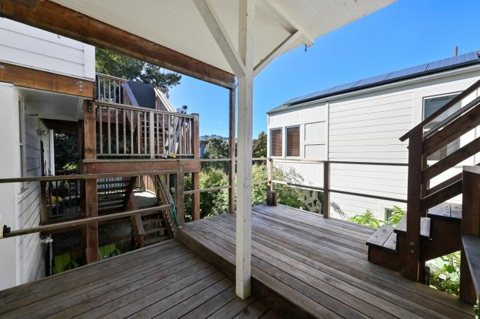 Property Thumbnail: Deck with overhang and steps leading up