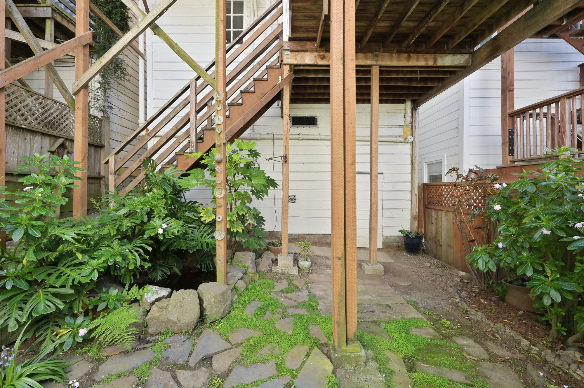 Property Photo: View of an outdoor pond and plants