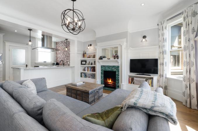 Property Thumbnail: Living room, featuring a fireplace with large white mantle and built-in book shelves