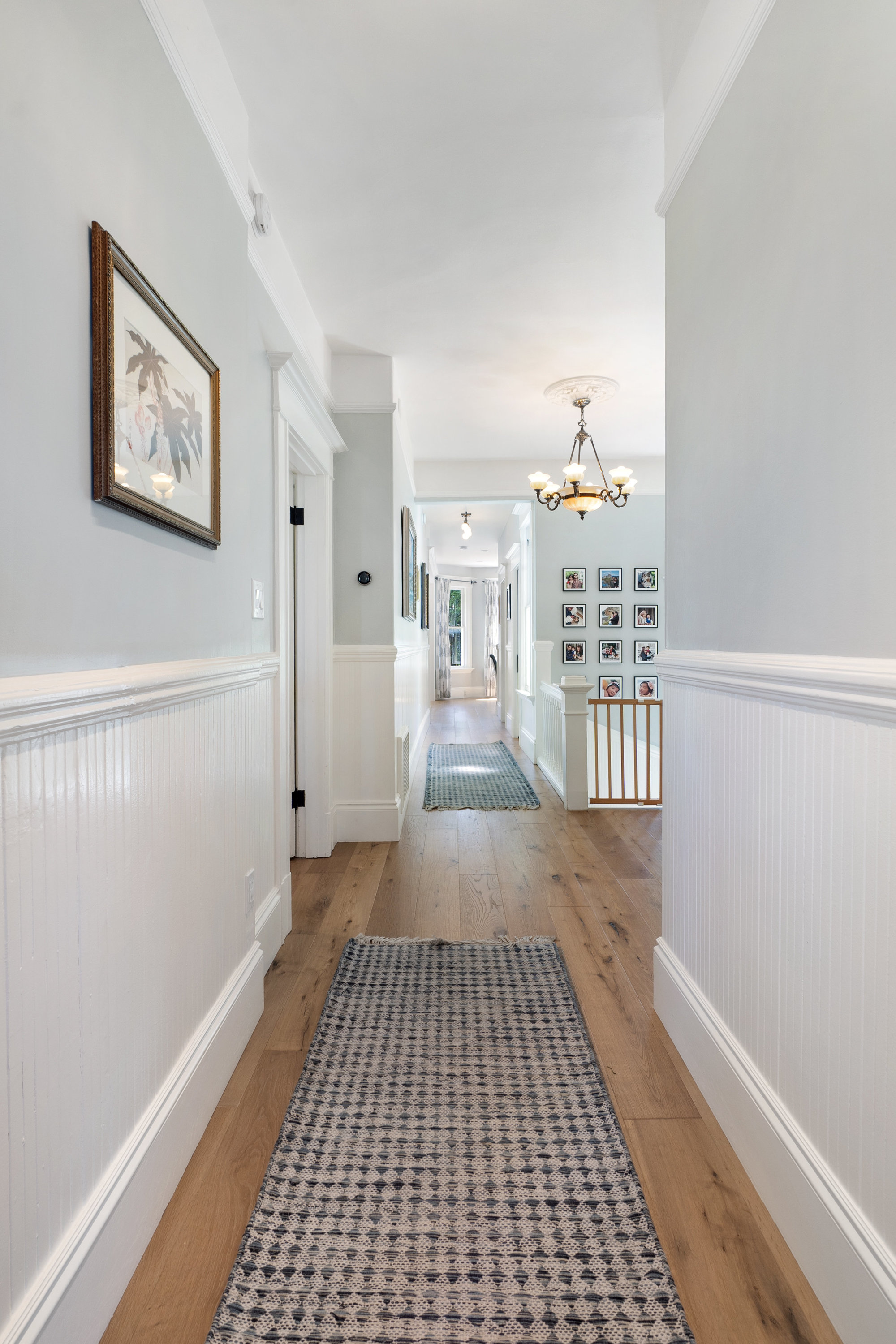 Property Photo: Hallway bathed in natural light