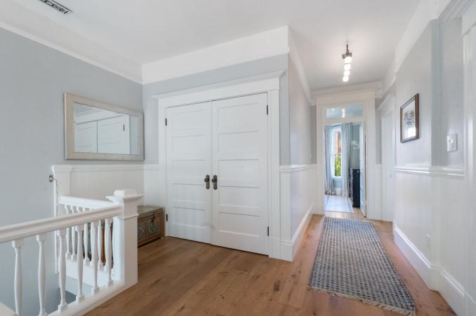 Property Thumbnail: View of a large double closet in the hall and wainscoting throughout 