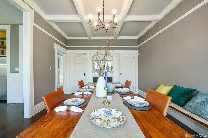 Property Thumbnail: Formal dining room, featuring a fireplace and built-in cabinets at one end