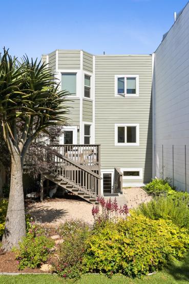 Property Thumbnail: Rear exterior view of 719 18th Avenue, showing a multi-level home