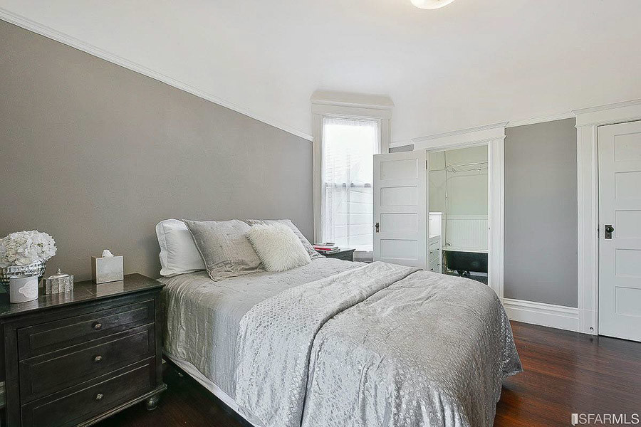 Property Photo: View of a bedroom with wood floors 