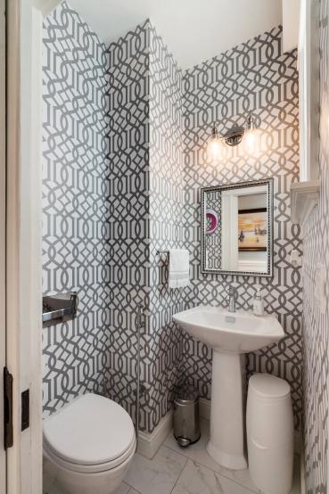 Property Thumbnail: View of bathroom two, featuring modern black and white wall paper