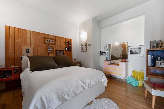 Property Thumbnail: View of the primary bedroom featuring wood floors
