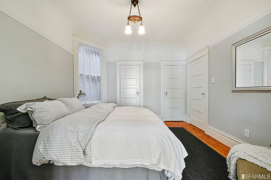 Property Photo: A bedroom with wood floors