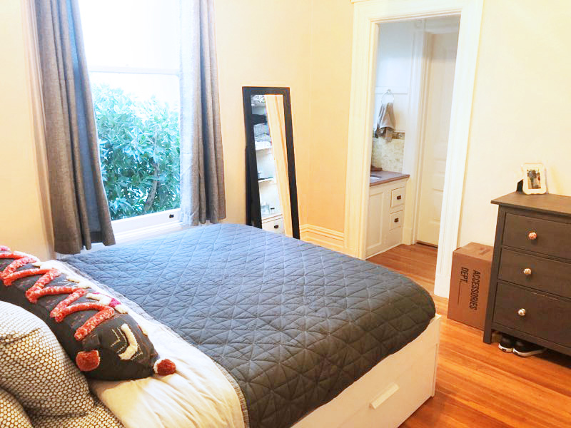 Property Photo: Second bedroom, featuring beautiful wood floors and plenty of natural light from a large window