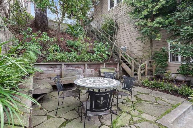 Property Thumbnail: View of the rear patio, featuring an outdoor dining area 