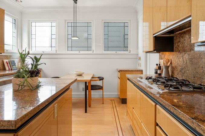 Property Thumbnail: Kitchen with high-end appliances and eat-in dining area at 4 Ashbury Terrace in Buena Vista