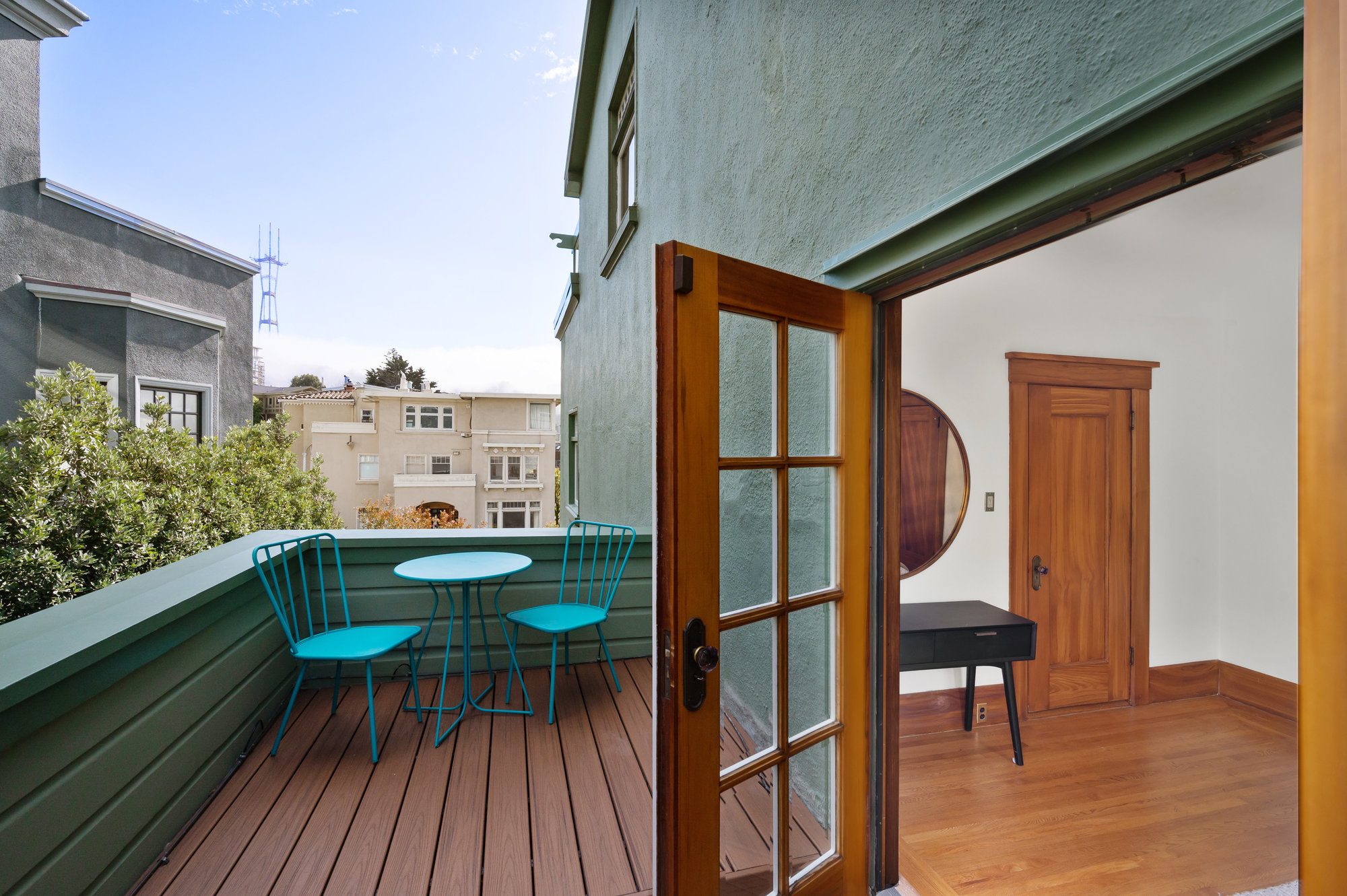 Property Photo: View from the balcony of bedroom two, featuring an outdoor sitting area