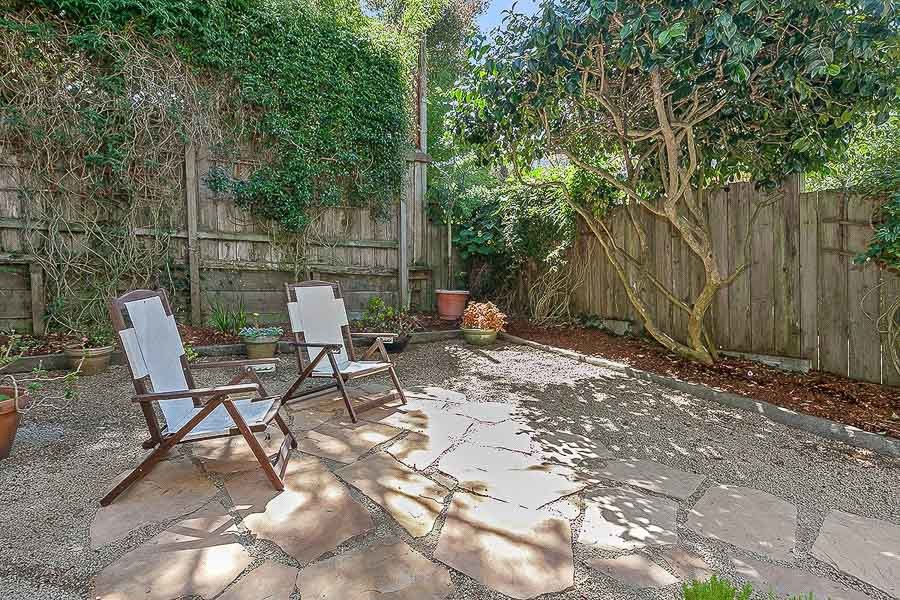Property Photo: View of a stone patio with seating area