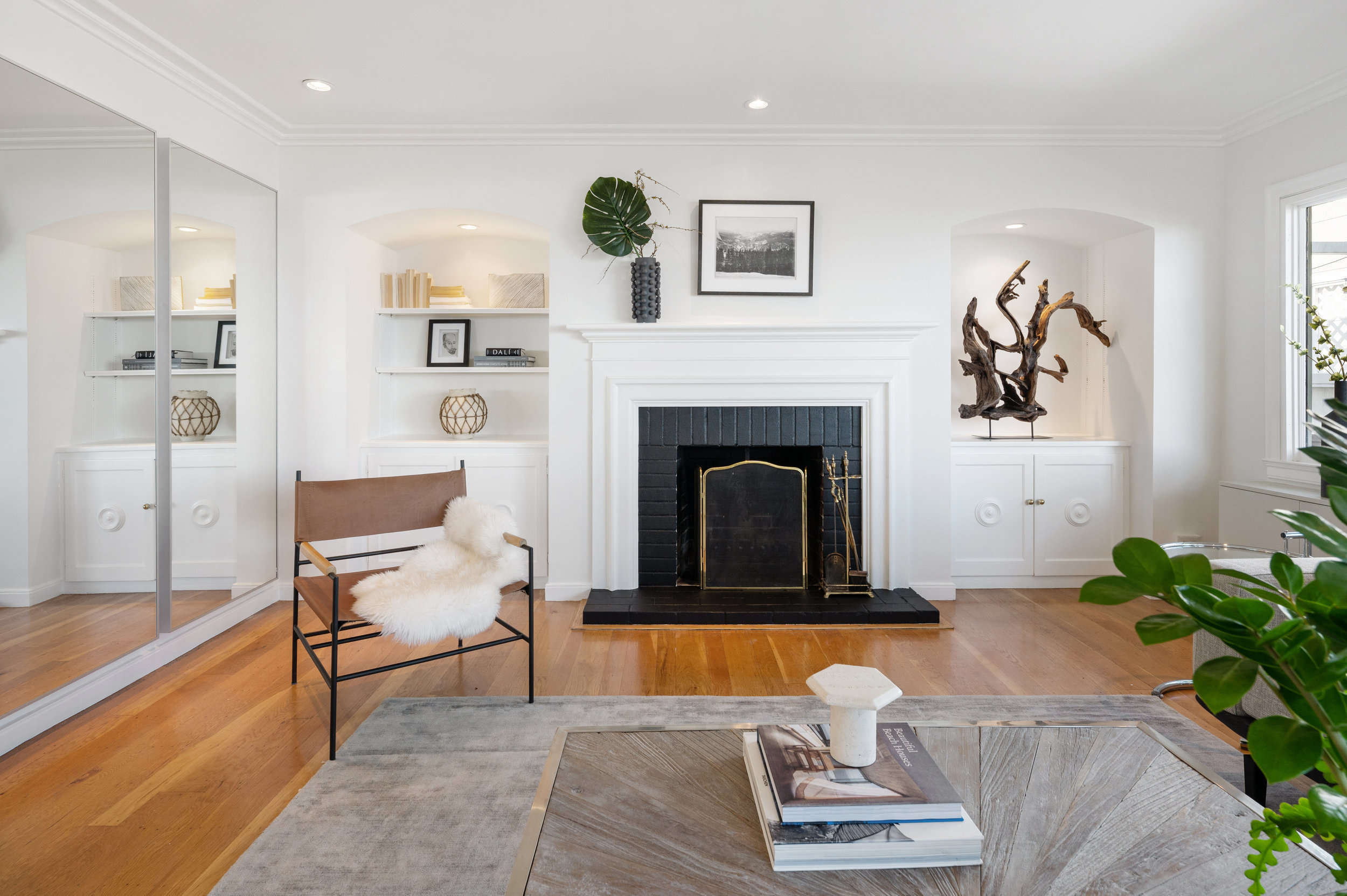 Property Photo: Close-up view of the fireplace with wood mantle